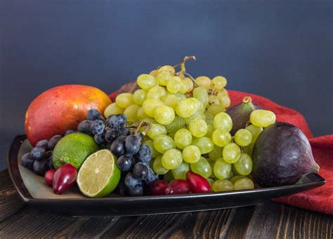 Exotic Fruits Variety Still Life With Grapes Figs Lime Peach Mango