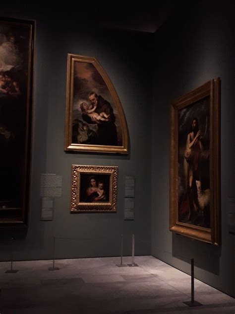 Three Paintings On Display In A Museum With One Being A Woman And The