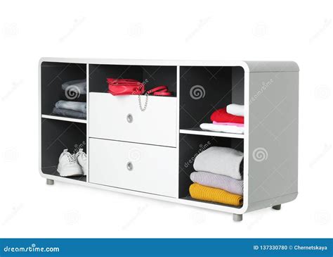 Stylish Shelving Unit With Clothes And Shoes On White Background Stock