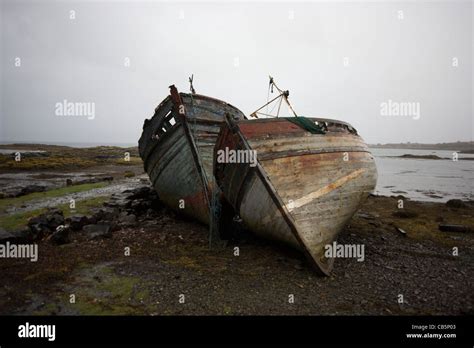 Wrecked Fishing Boats Beached On Shore At Salen Isle Of Mull Stock