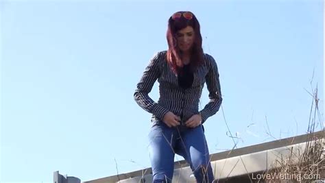 PISSING Cute Brunette Wets Her Pants ThisVid