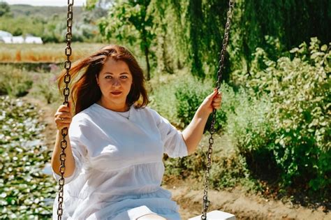 Premium Photo Girl On The Swing