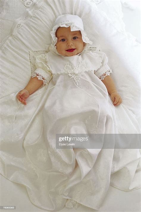 Smiling Baby In Baptismal Gown High Res Stock Photo Getty Images