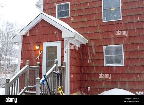 Red Suburban House In The Snow Storm Stock Photo Alamy