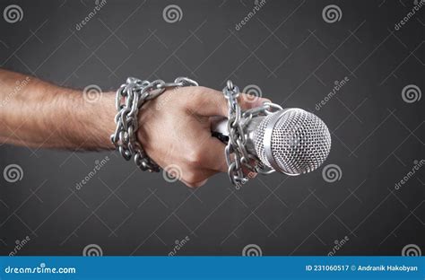 Human Hand Holding Microphone Tied With Chains Stock Image Image Of