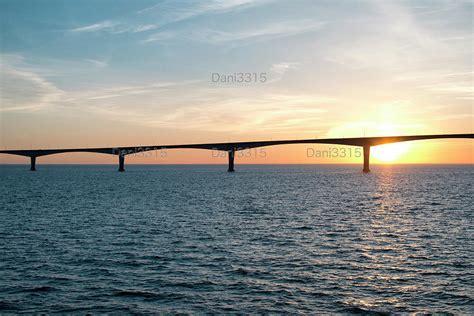 The Confederation Bridge over sunset sky Photograph by Visual Arts Gallery