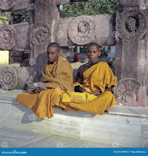 Young Buddhist Monks Laughing At A Window Editorial Image