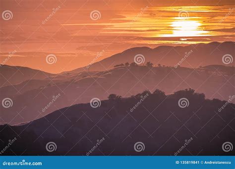 Beautiful Rolling Hills Bathed In The Sunset Light The Setting Sun