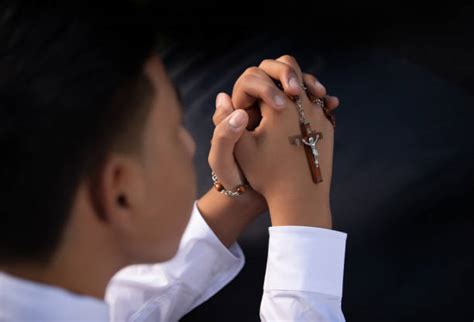 Kids Praying The Rosary Stock Photos Pictures And Royalty Free Images