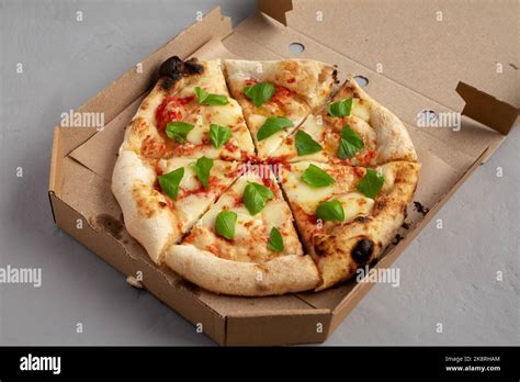 Organic Margarita Pizza With Basil And Mozarella In A Box Stock Photo