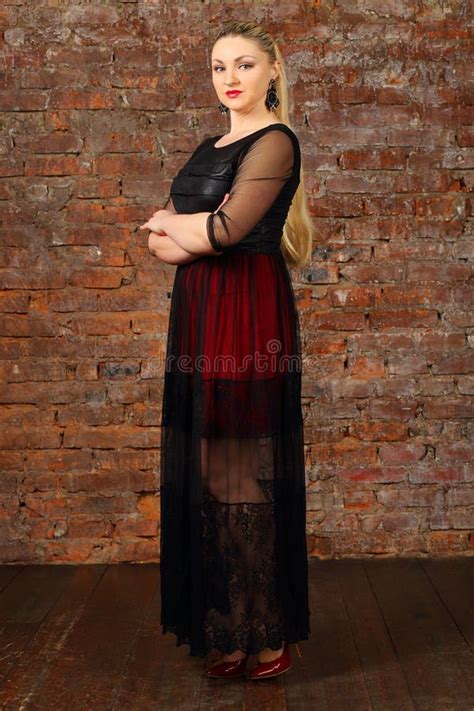 Pretty Blonde Woman In Dress Poses Near Red Brick Stock Photo Image Of Beautiful Cute