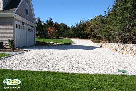 Seashell Driveway With Stone Retaining Wall And Stone Edging Landscape Services Stone