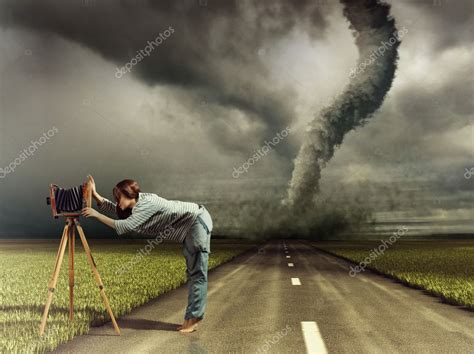 Photographer and tornado — Stock Photo © vicnt2815 #12738977