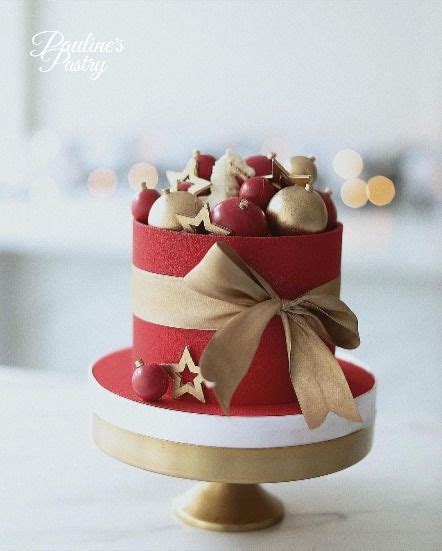 A Three Tiered Red And Gold Christmas Cake