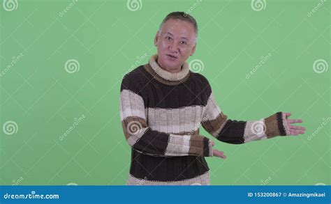 Happy Mature Japanese Man Vlogging And Talking To Camera Stock Video