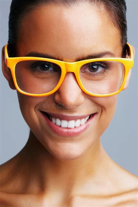 Detail Shot Of A Pretty Young Woman Wearing Glasses And Smiling Detail