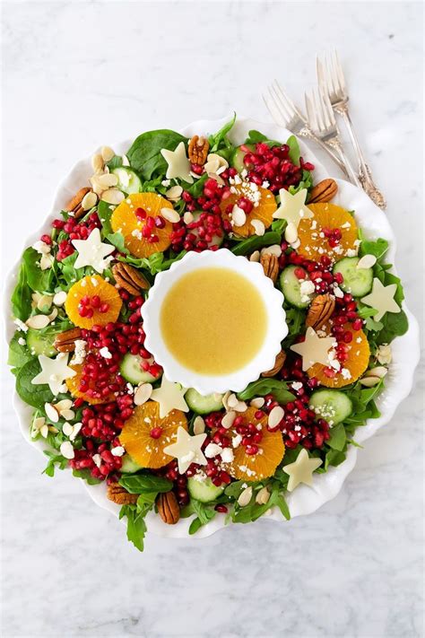 A Beautiful Christmas Salad Thats Shaped Like A Wreath And Topped With