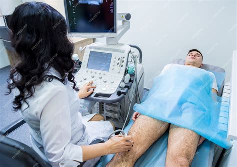 Premium Photo Doctor Using Ultrasound Scanning Machine Examining