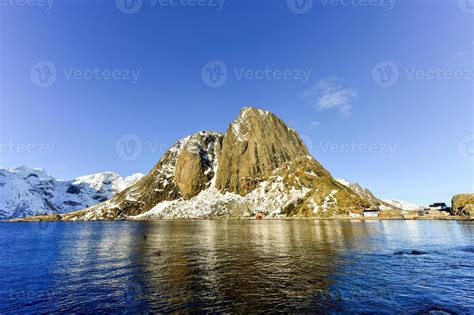 Fishing Hut In The Hamnoy And Lilandstinden Mountain Peak In Winter In