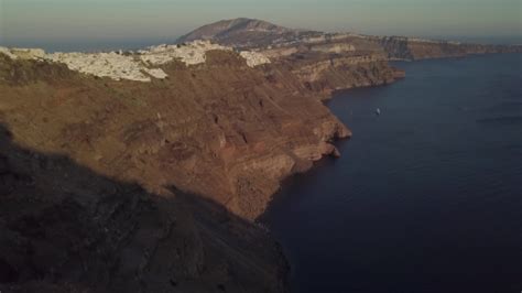 Santorini Aerial View Video of Greek Island with White Houses and Blue Roofs on Sunset and in ...