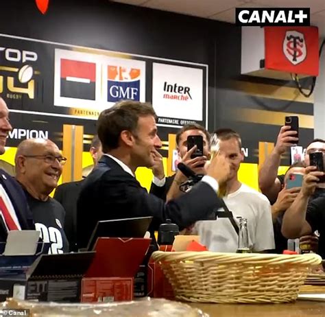 Emmanuel Macron downs a bottle of Corona in one while cheered on by Toulouse rugby players ...