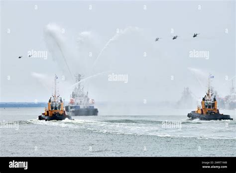 Fireboat sailing along Russian naval forces parade warships with ...