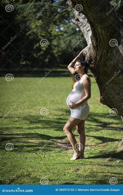 Portrait Of Pregnant Latina Woman In A Park Stock Photo Image Of