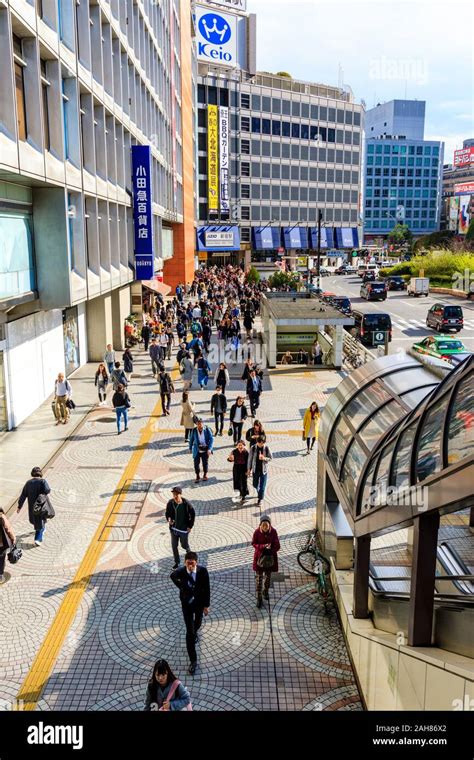 Daytime Overhead View Along The Crowded Pavement Outside The Odakyu Department Store And West