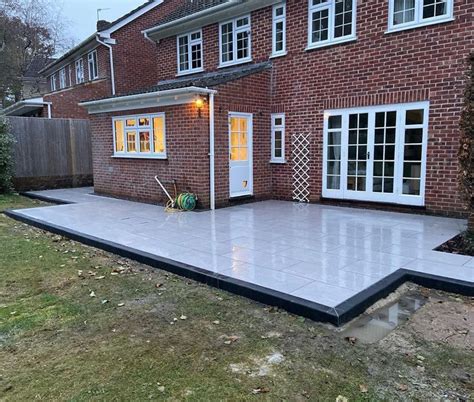 Sleek Porcelain Paving With Charcoal Kerbs