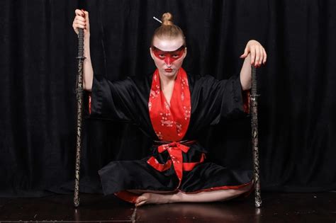 Premium Photo Young Woman Wearing Kimono And Make Up Holding Sword