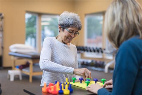 Occupational Therapist Works With An Elderly Woman Tulsa Nursing Center