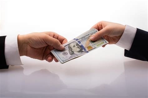 Premium Photo Businessman Giving And Receiving Dollar Banknote Money