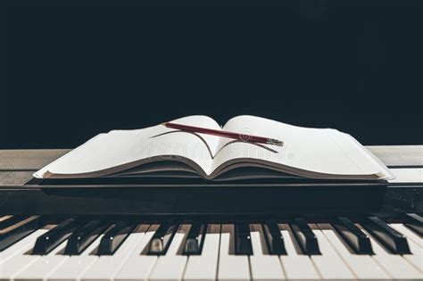 Open Notepad On Piano Keys In The Dark Copy Space Stock Photo Image