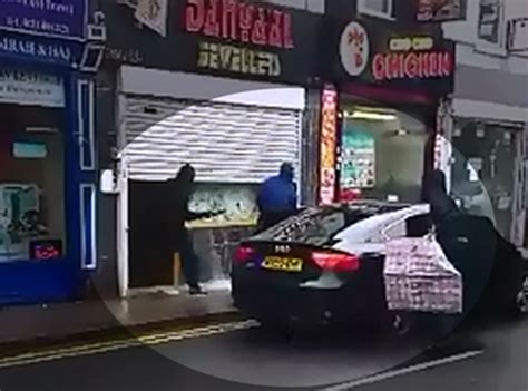 Video Watch Terrifying Moment Gang Of Masked Robbers Smash Their Way