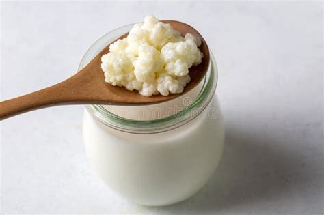 Kefir Fermented Milk Drink with Kefir Grains. Homemade Kefir Stands in ...