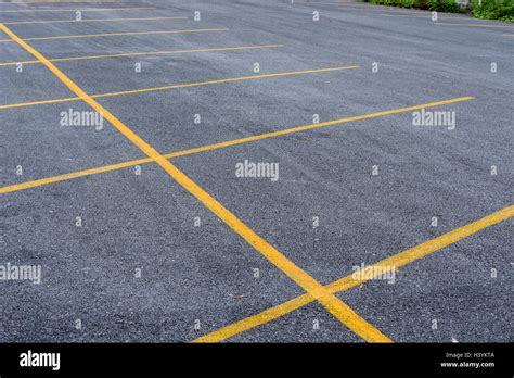 empty parking lot with yellow line Stock Photo - Alamy