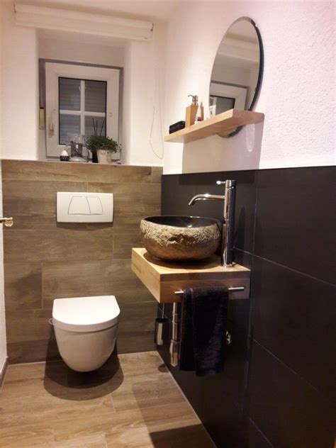 Renovierung Gäste WC Fließen Holzoptik und Anthrazit Naturstein