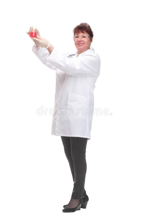 Side View Of Woman Doctor Dark Hair In Medical Coat Or Scientist Holding Beaker With Red Liquid