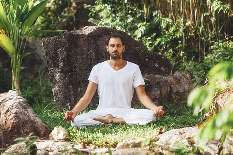 "Man Meditating In Nature" by Stocksy Contributor "Goldmund Lukic" - Stocksy