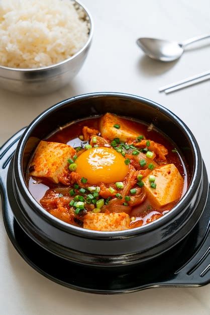 Premium Photo Kimchi Jjigae Or Kimchi Soup With Tofu And Egg Or