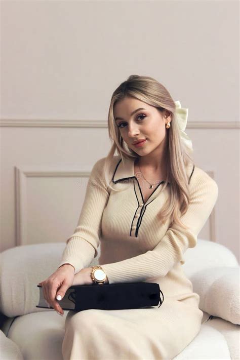 Portrait Of A Cute Beautiful Blonde Girl Holding And Reading A Book Stock Image Image Of