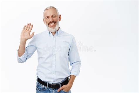 Handsome Smiling Mature Man Waving Hand And Saying Hello Greeting You