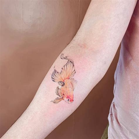 Micro Realistic Goldfish Tattoo Located On The Inner