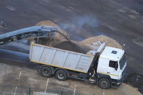 Premium Photo | Loading recycled asphalt to truck road removal milling machine, asphalt ...