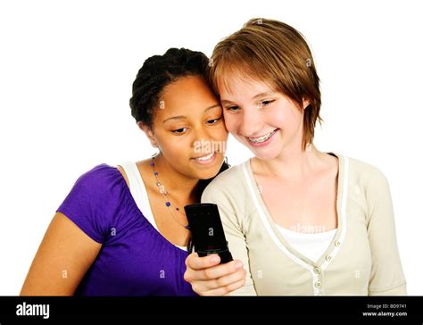 Isolated Portrait Of Two Teenage Girls With Cell Phone Stock Photo Alamy