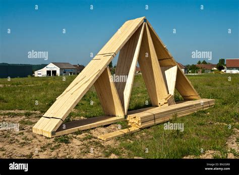 Timber Roof Trusses On New Domestic Housing Construction Building Site