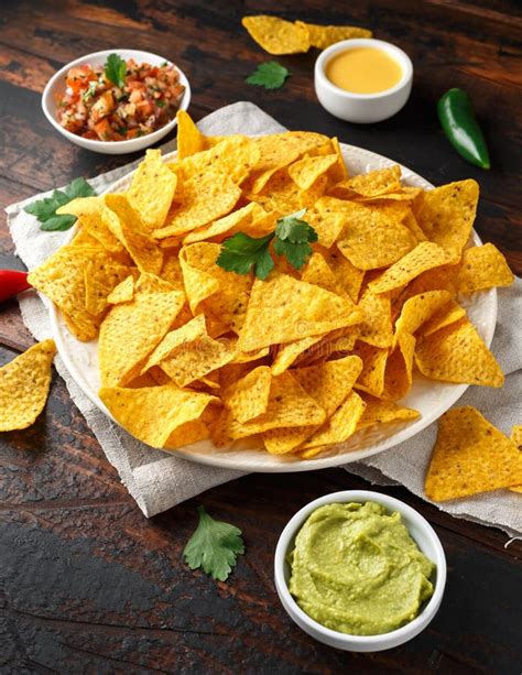 Tortilla Nachos Chips With Cheese Sauce Guacamole And Tomatoes Salsa