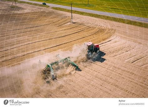 Aerial View Tractor Plowing Field Beginning Of Agricultural Spring