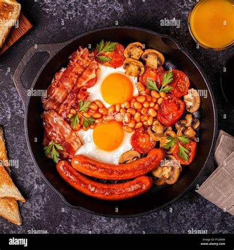 Traditional Full English Breakfast With Fried Eggs Sausages Beans