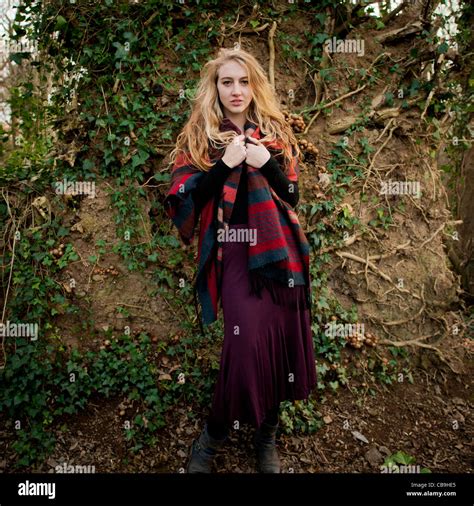 A Slim Blonde Woman Girl Alone In Woodland Autumn Afternoon Daytime Uk